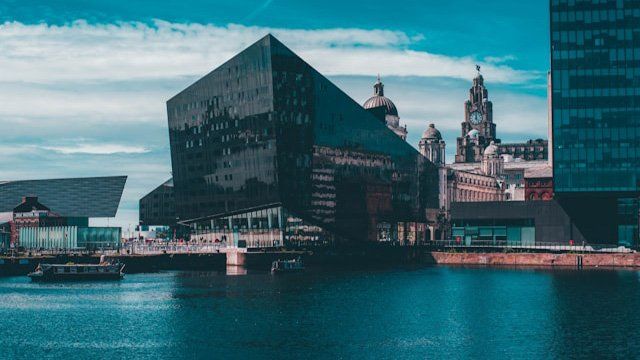 Mann Island's dark glass buildings on the waterfront, with the Royal Liver Building behind.